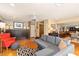 Comfortable living room with modern decor, hardwood floors, and views of dining room at 1618 Pepperidge Dr, Orlando, FL 32806