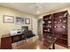 Home office featuring a desk, shelves, and a computer with printer at 1618 Pepperidge Dr, Orlando, FL 32806