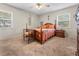Inviting bedroom with a cozy rug, ceiling fan, natural light, and wood furniture at 1620 Carolyn Ct, St Cloud, FL 34769