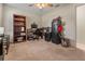 Cozy room with carpet, ceiling fan, desk, gun safe, and shelving at 1620 Carolyn Ct, St Cloud, FL 34769