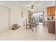Cozy dining area featuring tile flooring, a ceiling fan, and sliding glass doors to the lanai at 1620 Carolyn Ct, St Cloud, FL 34769