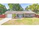 Charming single-story brick home featuring a well-maintained front yard and covered porch at 1620 Carolyn Ct, St Cloud, FL 34769