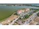 Beautiful aerial view of the condo complex near a stunning lake offering a serene waterfront living experience at 16300 County Road 455 # 405, Montverde, FL 34756