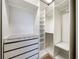 Organized walk-in closet with ample shelving and drawer space, providing optimal storage solutions at 16300 County Road 455 # 405, Montverde, FL 34756