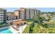 Beautiful view of condo's outdoor lounge, swimming pool and lake at 16300 County Road 455 # 405, Montverde, FL 34756