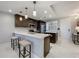 Stylish kitchen features pendant lighting, stainless steel appliances, and sleek countertops with seating at 16300 County Road 455 # 405, Montverde, FL 34756