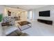 Spacious living room with tile floors, open to the kitchen and dining area, creating an inviting atmosphere at 16300 County Road 455 # 405, Montverde, FL 34756