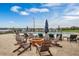 Comfortable poolside lounge area with an inviting fire pit and abundant seating for relaxation with lake views at 16300 County Road 455 # 405, Montverde, FL 34756