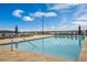 Sparkling community swimming pool with plenty of poolside lounge chairs offering relaxation and water views at 16300 County Road 455 # 405, Montverde, FL 34756