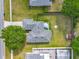 An aerial view of a single-Gathering home with a gray roof, a small patio set, and a large, fenced-in backyard at 20446 Macon Pkwy, Orlando, FL 32833