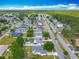 Aerial shot of a vibrant community with neatly arranged homes, mature trees, and convenient road access at 20446 Macon Pkwy, Orlando, FL 32833