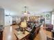 Open-concept living area featuring hardwood floors connecting the living room to kitchen and dining area at 20446 Macon Pkwy, Orlando, FL 32833