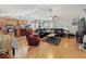 Bright living room featuring hardwood floors, a ceiling fan, comfortable seating and natural light at 20446 Macon Pkwy, Orlando, FL 32833