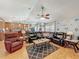Spacious living room with hardwood floors, neutral walls, ample seating, and abundant natural light at 20446 Macon Pkwy, Orlando, FL 32833