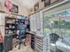 Inviting home office features a desk and ample storage, with a patio view to the outdoor living space at 20446 Macon Pkwy, Orlando, FL 32833