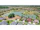 Beautiful aerial view of homes surrounding a scenic pond and golf course in a vibrant community at 2086 Biller Cir, The Villages, FL 32163