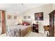 Cozy bedroom featuring a queen bed and decorative art at 2086 Biller Cir, The Villages, FL 32163