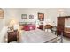 Comfortable bedroom with a full bed and charming decor at 2086 Biller Cir, The Villages, FL 32163