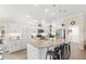 Well-lit kitchen with stainless steel appliances, large center island, and barstool seating at 2086 Biller Cir, The Villages, FL 32163