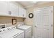 Convenient laundry room featuring a washer and dryer at 2086 Biller Cir, The Villages, FL 32163