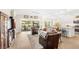 Open concept living room with water views and access to the outdoor patio at 2086 Biller Cir, The Villages, FL 32163