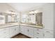 Well-lit main bathroom with double sinks, spacious countertops, and plenty of storage space at 2086 Biller Cir, The Villages, FL 32163
