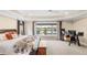 Bright main bedroom offering lots of natural light with views of the water and an outdoor patio at 2086 Biller Cir, The Villages, FL 32163