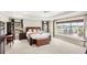 Serene main bedroom with scenic water views and neutral tones and dark wood furniture at 2086 Biller Cir, The Villages, FL 32163