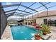 Beautiful screened-in pool featuring a spa and a patio area perfect for entertaining at 2086 Biller Cir, The Villages, FL 32163