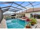 Beautiful screened-in pool featuring a spa and a patio area perfect for entertaining at 2086 Biller Cir, The Villages, FL 32163