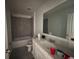 This bathroom features a tiled shower and a single vanity at 264 Hayley St, Winter Haven, FL 33884