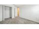 Clean bedroom with gray carpet, featuring a closet with an open door at 264 Hayley St, Winter Haven, FL 33884
