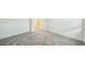 Gray carpet leading to an open door shows access to other rooms at 264 Hayley St, Winter Haven, FL 33884