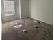 This bedroom features a window for natural light and neutral carpet at 264 Hayley St, Winter Haven, FL 33884