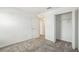 Cozy bedroom with gray carpet, featuring an open closet and doorway at 264 Hayley St, Winter Haven, FL 33884