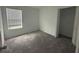 This bedroom features a window, closet, and neutral carpet at 264 Hayley St, Winter Haven, FL 33884