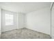 Cozy bedroom featuring gray carpet and a bright window for natural light at 264 Hayley St, Winter Haven, FL 33884