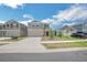 View of the front exterior of the home featuring a driveway and landscaping at 264 Hayley St, Winter Haven, FL 33884