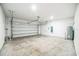 Spacious two-car garage with ample storage space, ready for your vehicles and projects at 264 Hayley St, Winter Haven, FL 33884