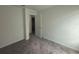 A neutral hallway provides access to other areas of the home at 264 Hayley St, Winter Haven, FL 33884