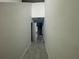 A neutral hallway provides access to other areas of the home at 264 Hayley St, Winter Haven, FL 33884