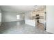 A kitchen island and stainless steel appliances are featured in this room at 264 Hayley St, Winter Haven, FL 33884