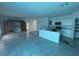 Spacious kitchen area with an island and white cabinets at 264 Hayley St, Winter Haven, FL 33884