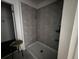 Modern shower with sleek tile and built-in shelving, providing a spa-like experience in your own home at 264 Hayley St, Winter Haven, FL 33884