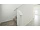 Carpeted staircase with white trim and handrail leading to the upper level at 264 Hayley St, Winter Haven, FL 33884