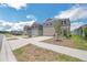 Street view of the homes, showing the sidewalks and landscaping at 264 Hayley St, Winter Haven, FL 33884
