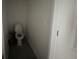 A well-lit water closet with a standard toilet, designed for functionality and privacy at 264 Hayley St, Winter Haven, FL 33884