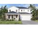 Inviting two-story home featuring a modern white facade, covered entryway, and a two-car garage at 30269 Rustic Mill St, Mount Dora, FL 32757