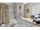 Bright bathroom featuring a shower-tub combo with a decorative shower curtain and granite vanity at 304 Southern Pecan Cir # 105, Winter Garden, FL 34787