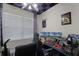 Unique bedroom designed as a gaming room with desk, chair, and wall decor at 304 Southern Pecan Cir # 105, Winter Garden, FL 34787